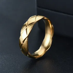 Detailed view of gold-plated stainless steel ring with quilted rhombus pattern