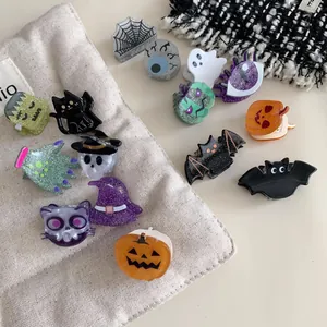 Set of creative Halloween hair claw clips featuring pumpkin, ghost, bat, and skull shapes