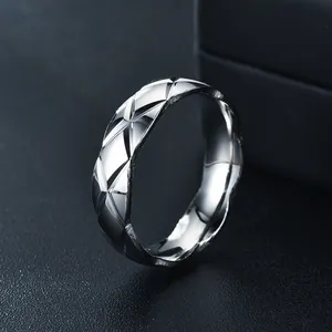 Detailed close-up of the quilted diamond-cut texture on a silver stainless steel ring.