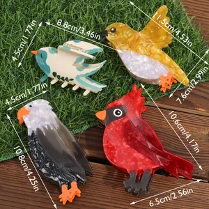Set of four colorful bird-shaped acetate hair claw clips with size dimensions