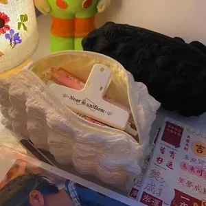 Close-up of cute cream puff ruffled pencil case with large storage capacity