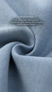 Macro view of soft light blue knit fabric for custom oversized hoodies
