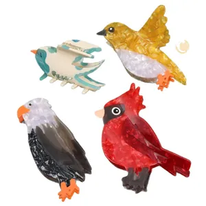 Set of four colorful acetate bird-shaped hair claw clips with various bird designs