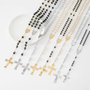 Variety of stainless steel beaded rosary necklaces with cross pendants displayed on white.
