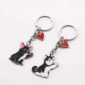 Detailed view of cute waving French Bulldog and Husky zinc alloy keychains with red heart