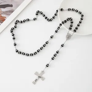 Detailed view of a minimalist stainless steel rosary necklace with black striped beads.
