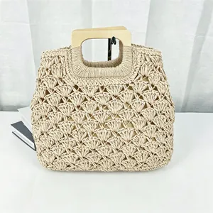 Vintage handmade woven straw tote bag with square wooden handles for beach and travel