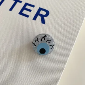 Quirky Halloween eyeball hair clip with blue iris and glittery acrylic finish for hair