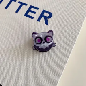 Macro view of purple Halloween monster cat acrylic mini hair claw clip for girls
