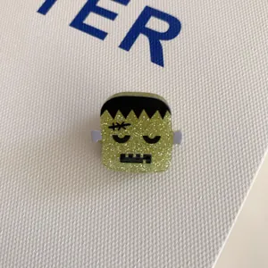 Cute green Frankenstein glitter hair claw clip with funny face for Halloween theme