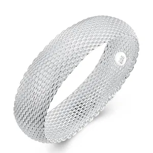 Detailed close-up of a silver plated mesh bangle bracelet with 925 silver stamp