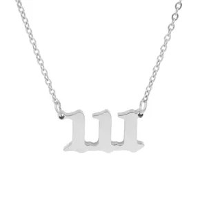 Close-up detail of a silver-toned angel number 111 pendant on a sleek metal chain