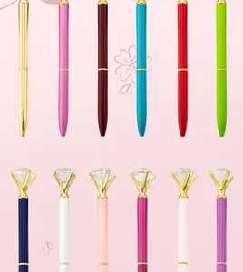 Close-up of metal ballpoint pens with large diamond crystals in various colors