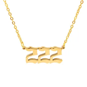 Detailed view of gold 222 angel number pendant on a stainless steel O-chain necklace.