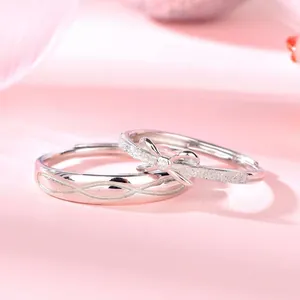 Squisite fedi per coppia in argento sterling S925 con design a fiocco e a onde opache