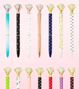 Collection of elegant metal ballpoint pens featuring large diamond-shaped crystal tops