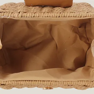 Internal view of a fashionable woven paper rope crossbody bag with soft lining.