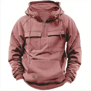 Men's solid pink hooded sweatshirt with multi-pocket design and leather patch detail.