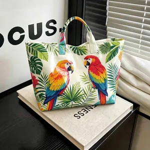 Waterdichte PVC canvas draagtas met een levendige tropische print van een papegaai