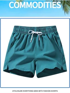 Quick-dry men's athletic ice silk shorts in teal green with drawstring waist and side slits