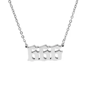 Detail of stainless steel 666 angel number pendant necklace in gothic font