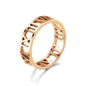 Elegant rose gold stainless steel ring featuring intricate cut-out Roman numeral details.