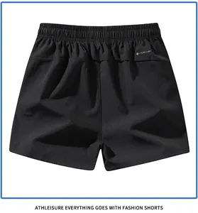 Detailed back view of black quick-dry athletic shorts featuring elastic waistband.