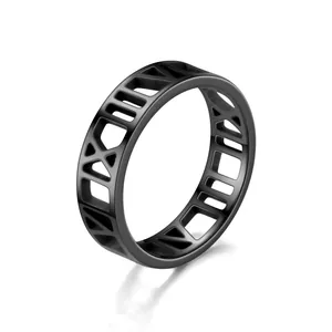 Detailed view of matte black stainless steel ring with hollow Roman numeral design