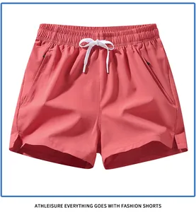 Men's quick-dry coral pink athletic shorts with drawstring and zipper pockets