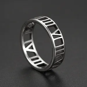 High-quality macro detail of a silver stainless steel ring with cutout Roman numerals