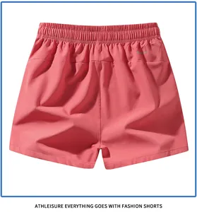 Back view of men's coral quick-dry athletic shorts with elastic waist
