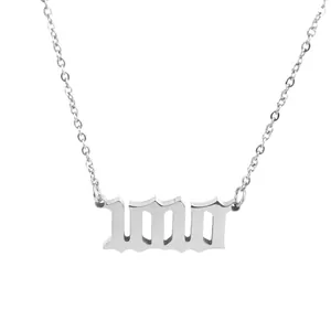 Close-up of silver stainless steel necklace with gothic 1010 angel number pendant