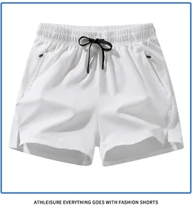 Front view of white quick-dry men's sports shorts with black drawstring detail.