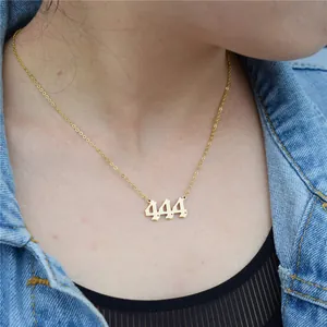 Detailed view of a gold stainless steel necklace with a gothic 444 angel number pendant.