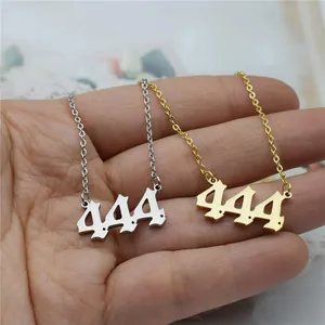 Detail of 444 angel number necklaces in gold and silver stainless steel.