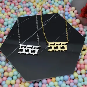Detailed view of gold and silver stainless steel necklaces with 555 angel number pendants.