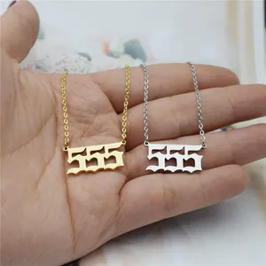 Close-up detail of gold and silver 555 angel number necklaces made of stainless steel