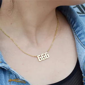 Close-up shot of golden stainless steel 666 angel number pendant necklace for women