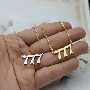 Detailed macro view of 777 angel number necklaces in gold and silver steel finish.