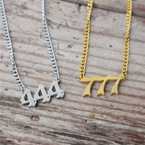 Stainless steel angel number 444 and 777 necklaces shown on a rustic wood background