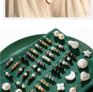 Detailed display of colorful faux pearl pendants in star heart and moon shapes for DIY jewelry