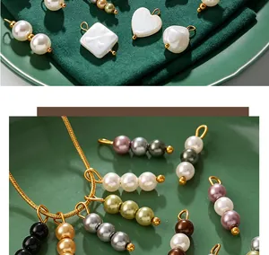 Detailed view of colorful imitation pearl pendants in heart, square, and bead shapes