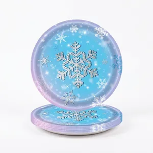 Detail of blue disposable paper plates with silver snowflake patterns for parties