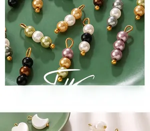 Close-up detail of colorful imitation pearl pendants in heart, moon and bead shapes