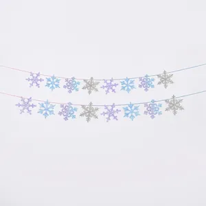 Detail of blue and purple glitter snowflake garland banner for winter party decor