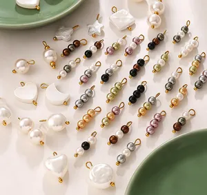 Macro view of mixed color imitation pearl charms in heart star and moon shapes for DIY