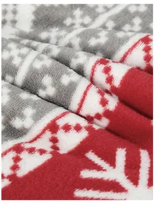 Close-up of soft Christmas snowflake print flannel fabric for winter blankets