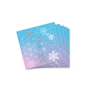 Detailed view of blue and purple gradient napkins with silver snowflake patterns for parties