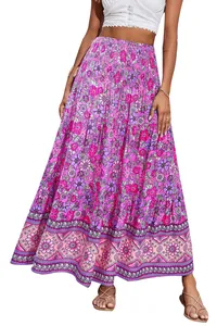 Detail of bohemian floral print maxi skirt with high smocked waist and tiered hem