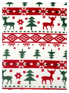 Détail d'un tissu de flanelle de Noël festif avec motif de renne rouge et vert